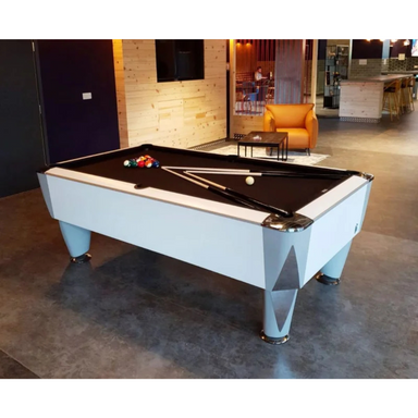 Pool table with cues and balls in a modern room setting